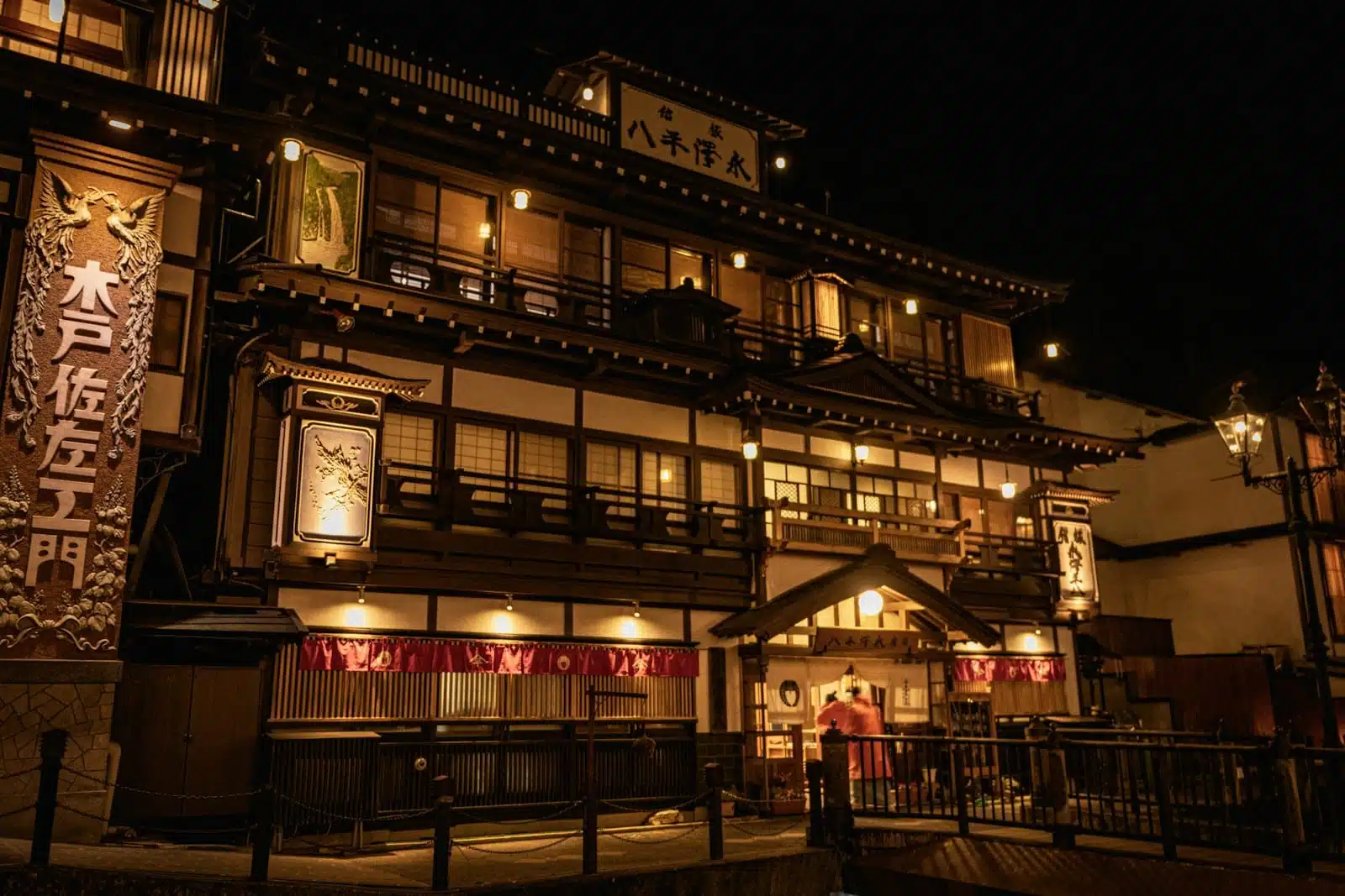 a building lit up at night with lights on