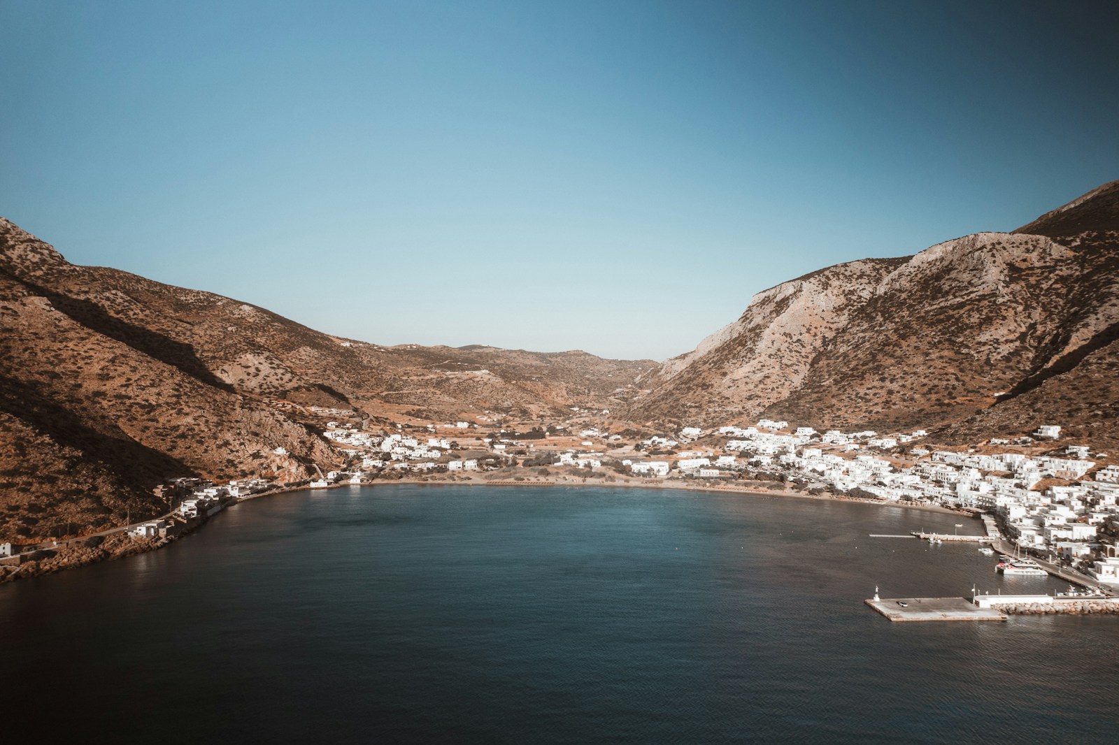 A large body of water surrounded by mountains