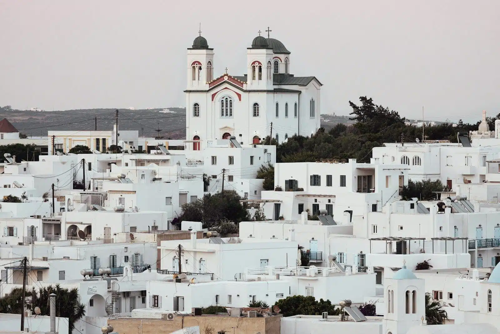 a large white building with a tower