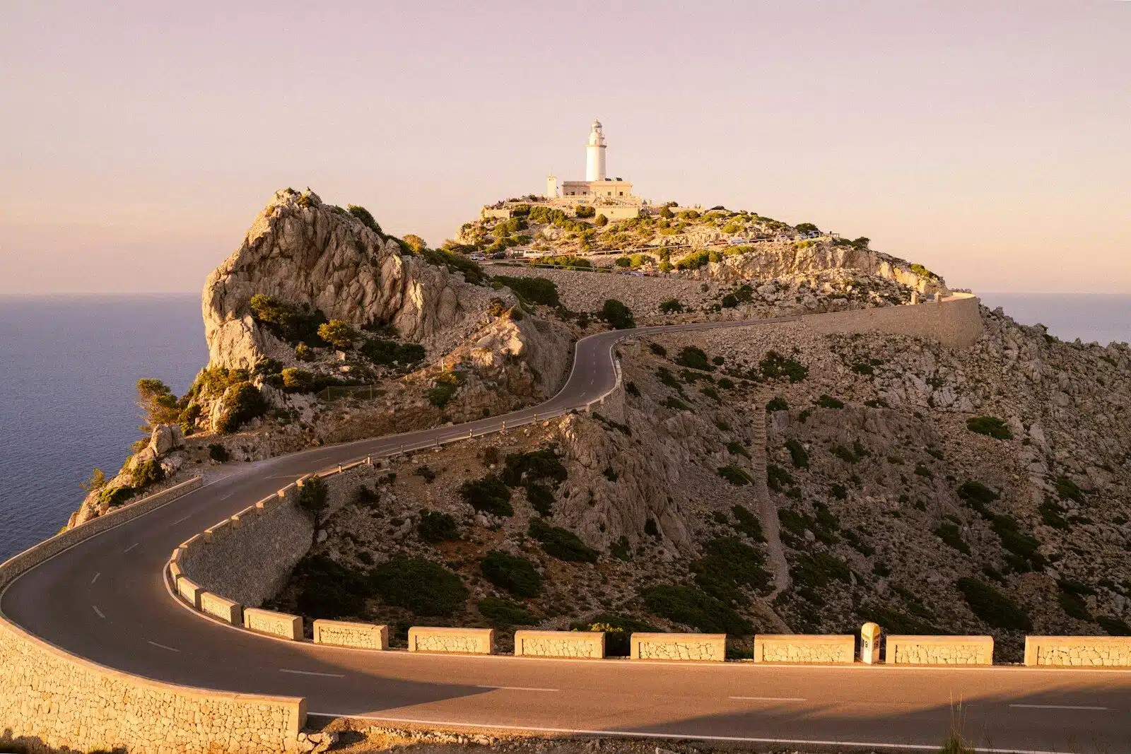 white and brown concrete building on top of mountain during daytime