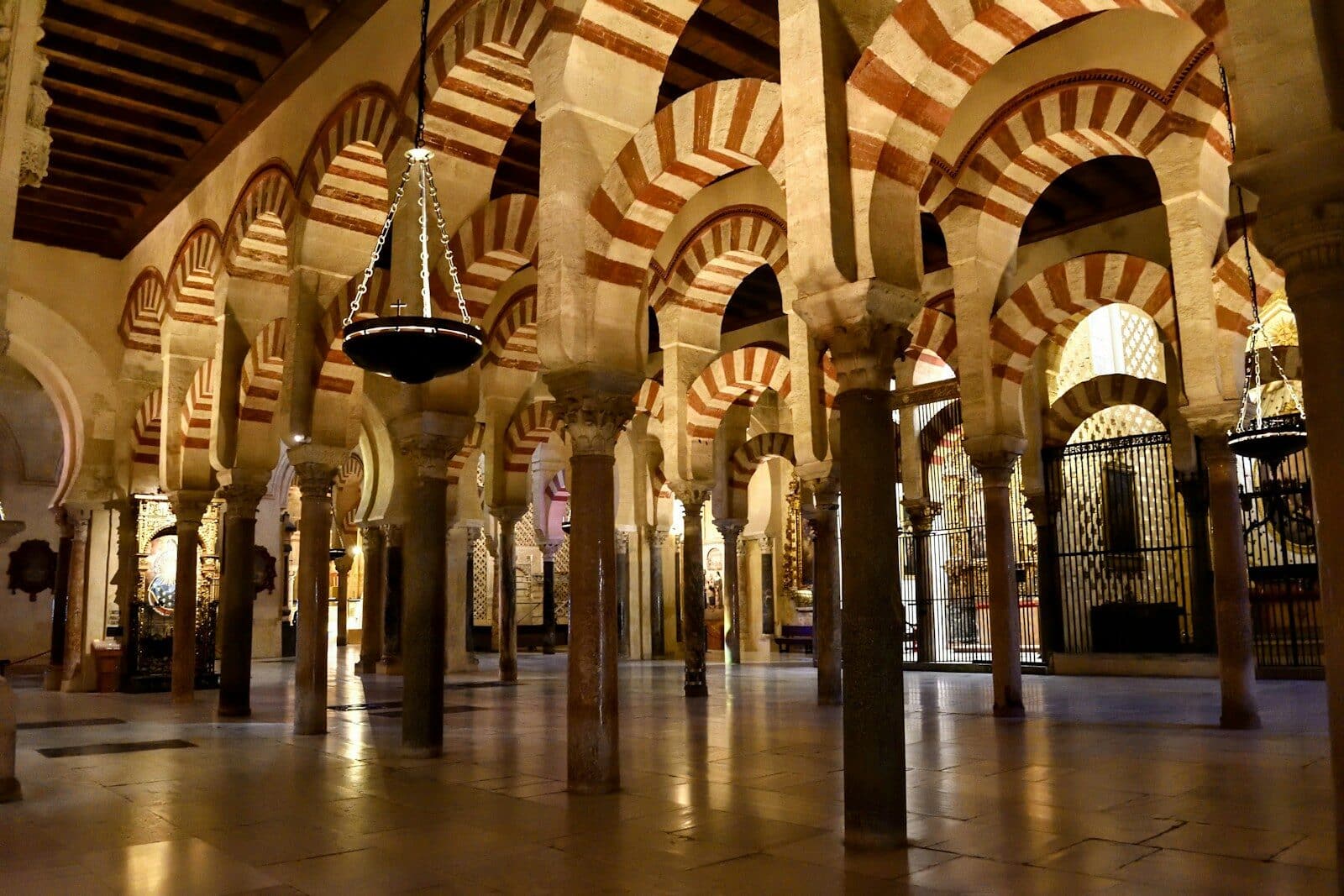 A large room with many pillars and arches