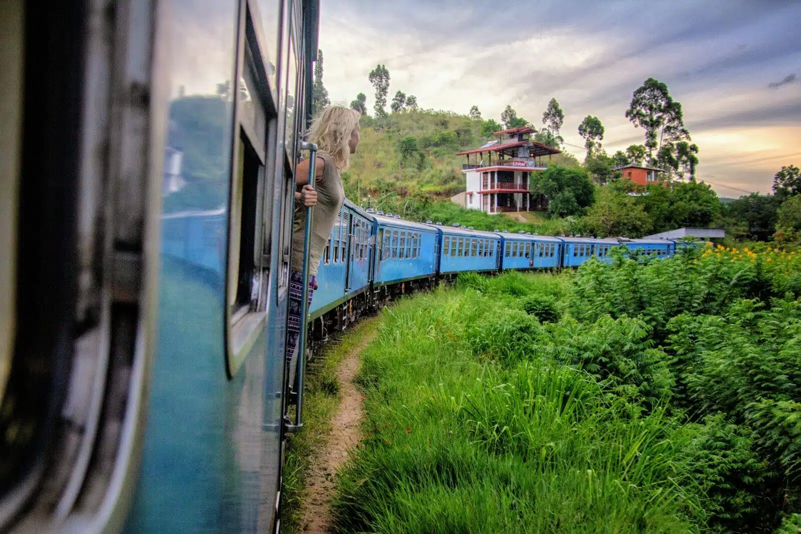 A train travels through Sri Lanka's tea country hills on the Kandy to Ella route.