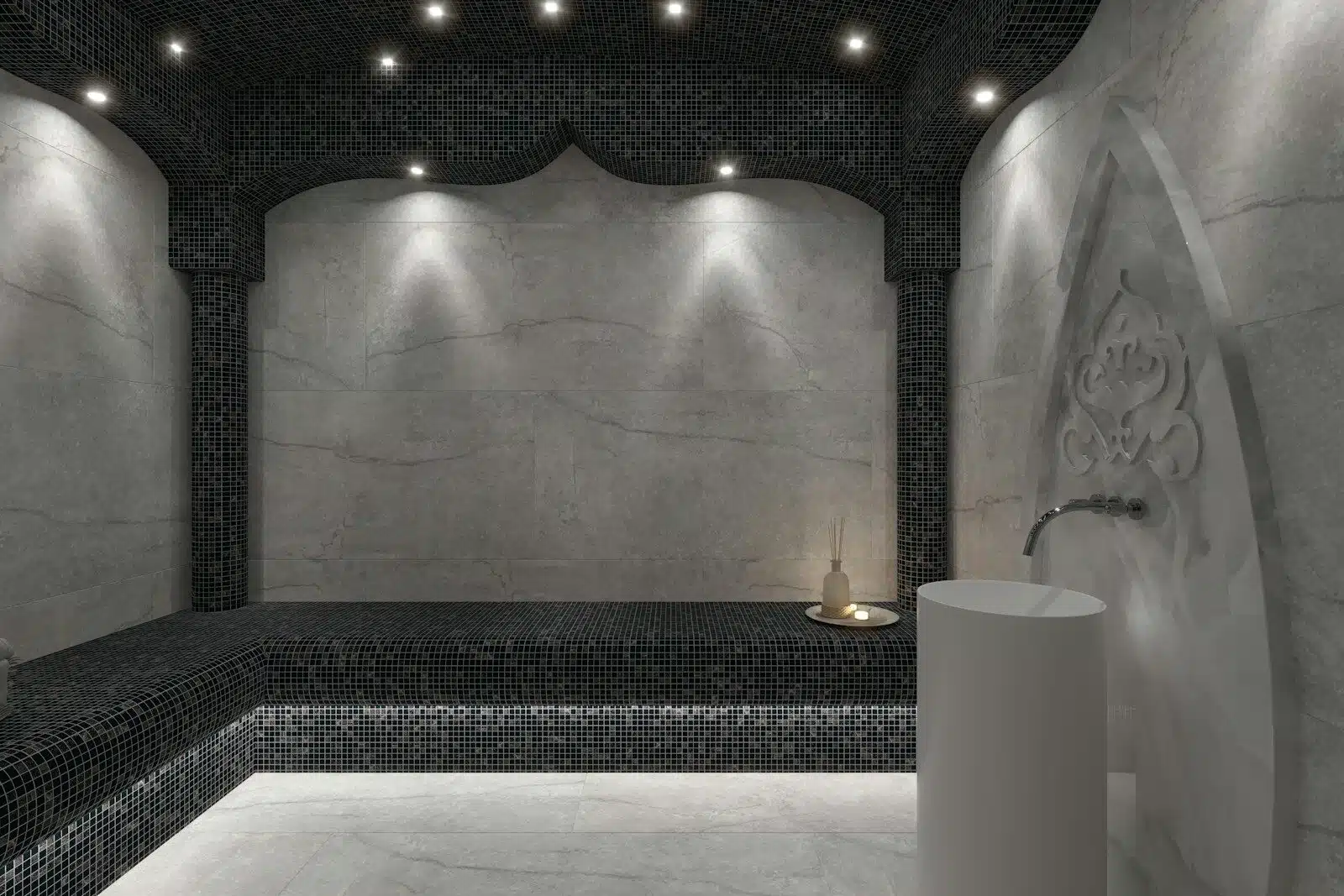 a bathroom with a black and white tiled wall