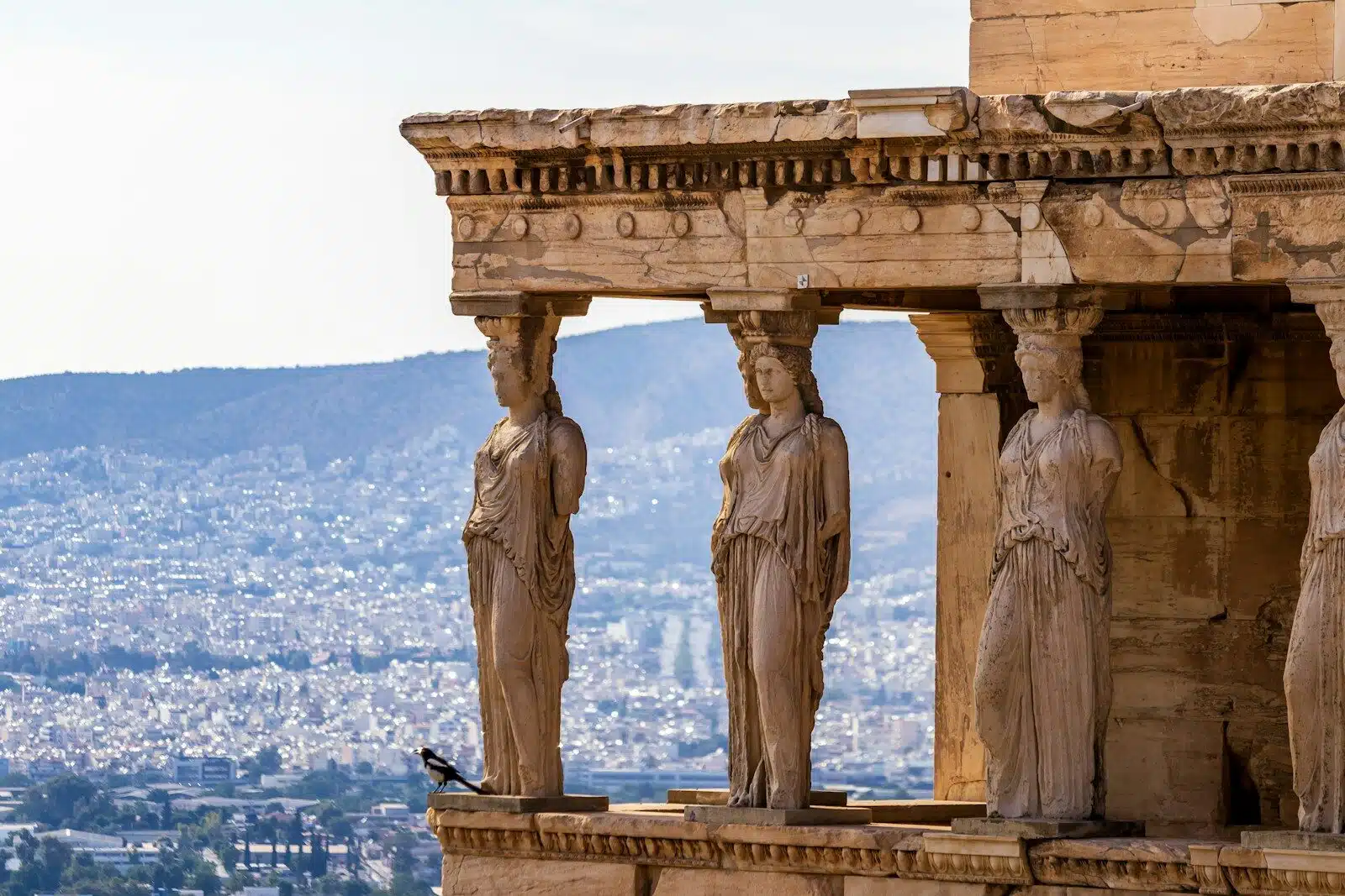 A group of statues on the side of a building